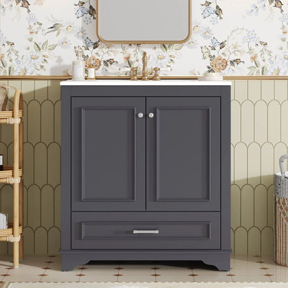 Dark gray bathroom vanity with white top, two doors, brass faucet and mirror above on Tampa Home & Garden Store