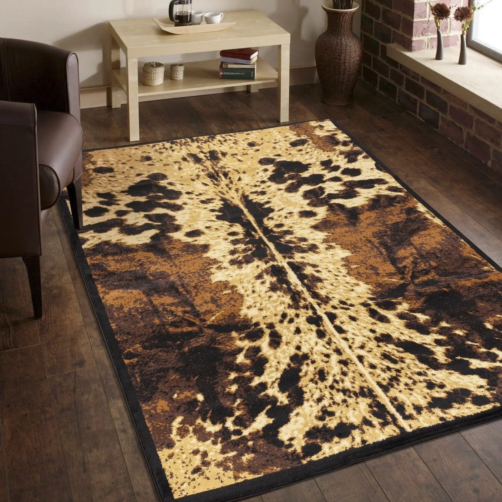 Tribes Southwest Area Rug by Unique Piece Furniture, cowhide pattern in tan and black on Tampa Home & Garden Store