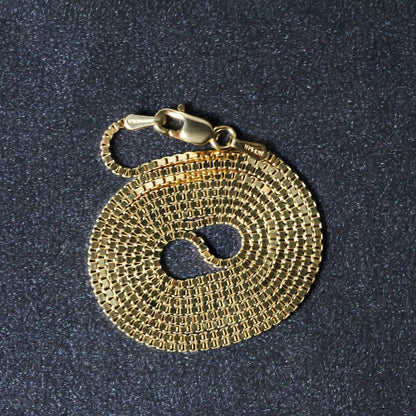 14k yellow gold box chain necklace 1.1mm, lobster clasp, coiled circular display on Tampa Home & Garden Store