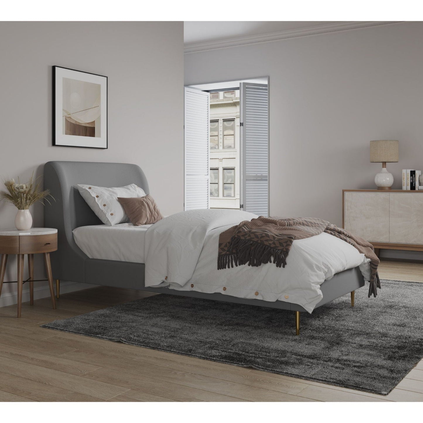 Mid-Century Modern grey upholstered bed with curved headboard, white linens and brown throw on Tampa Home & Garden Store