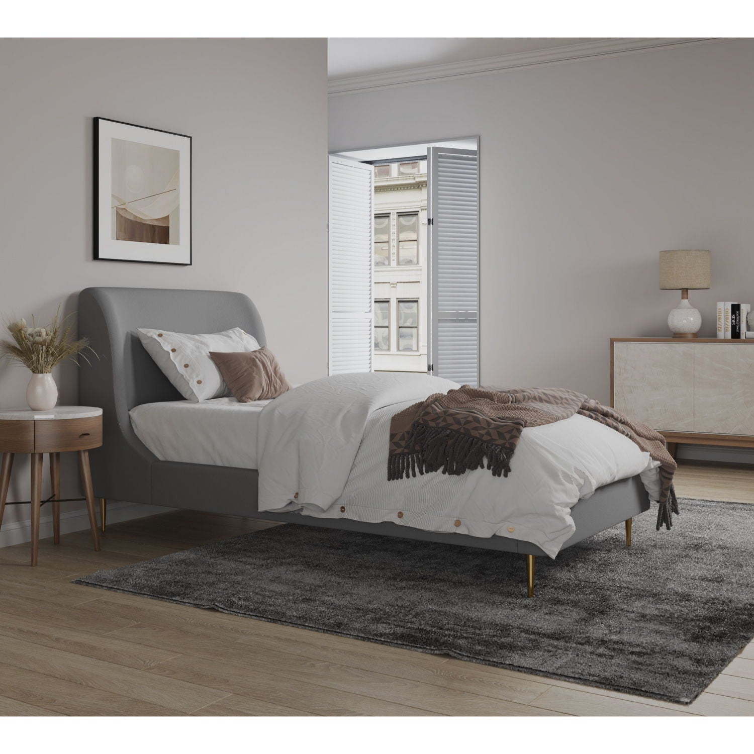 Mid-Century Modern grey upholstered bed with curved headboard, white linens and brown throw on Tampa Home & Garden Store