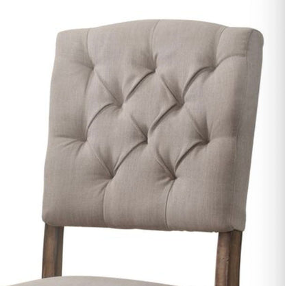 Weathered Side Chair with button tufting in beige upholstery by HouseOfZazla set on Tampa Home & Garden Store