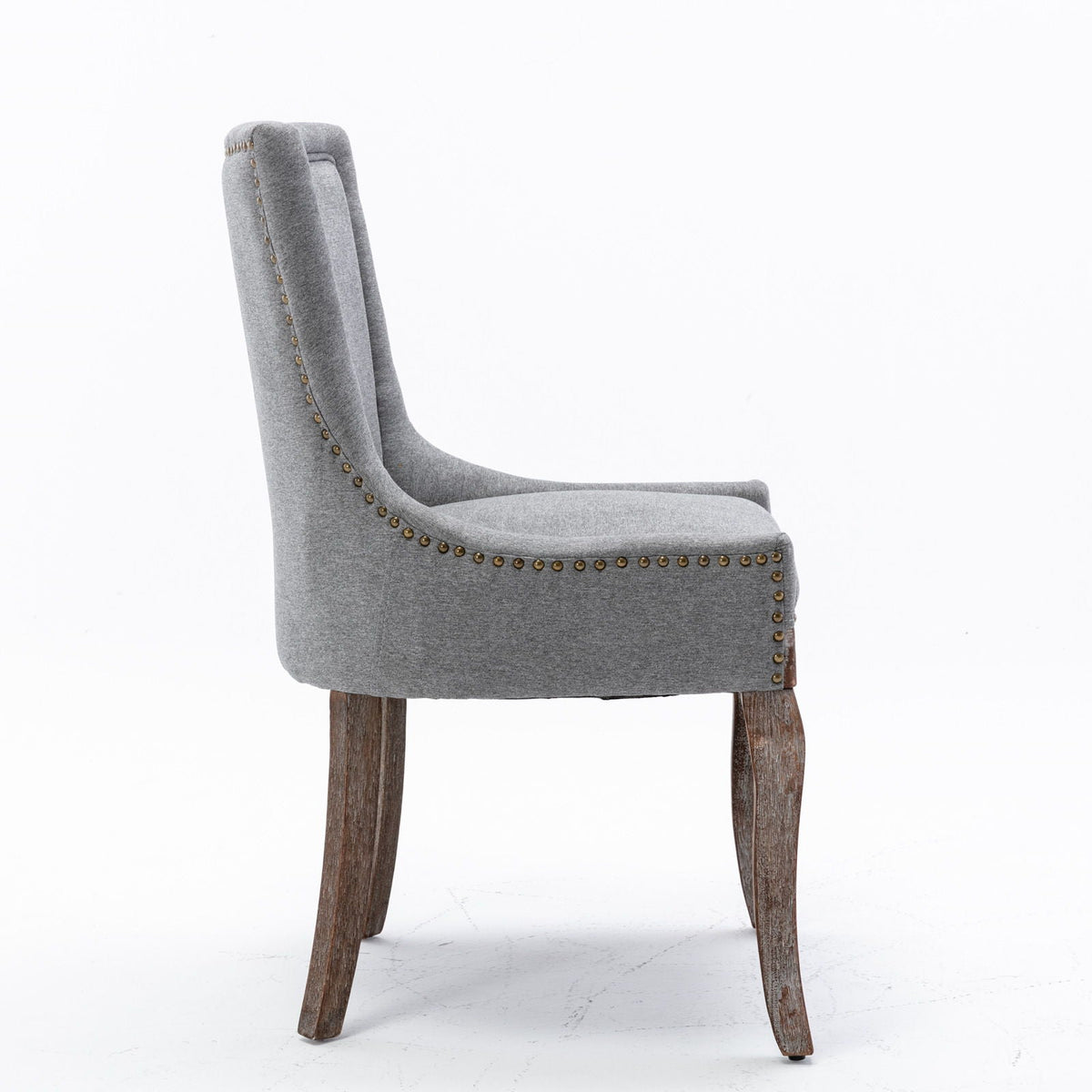 Ultra Side Dining Chair gray fabric with nailhead trim along edges and curved back on wooden legs on Tampa Home & Garden Store