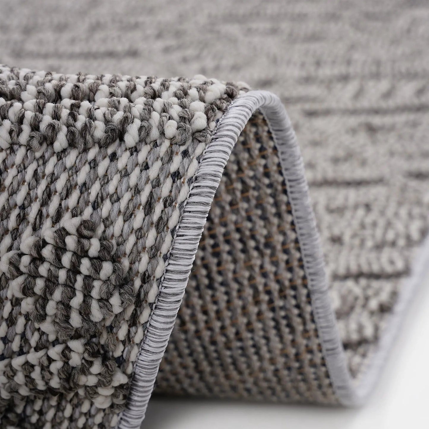 Guros indoor/outdoor rug in grey looped yarn with braided edge by Unique Piece Furniture on Tampa Home & Garden Store