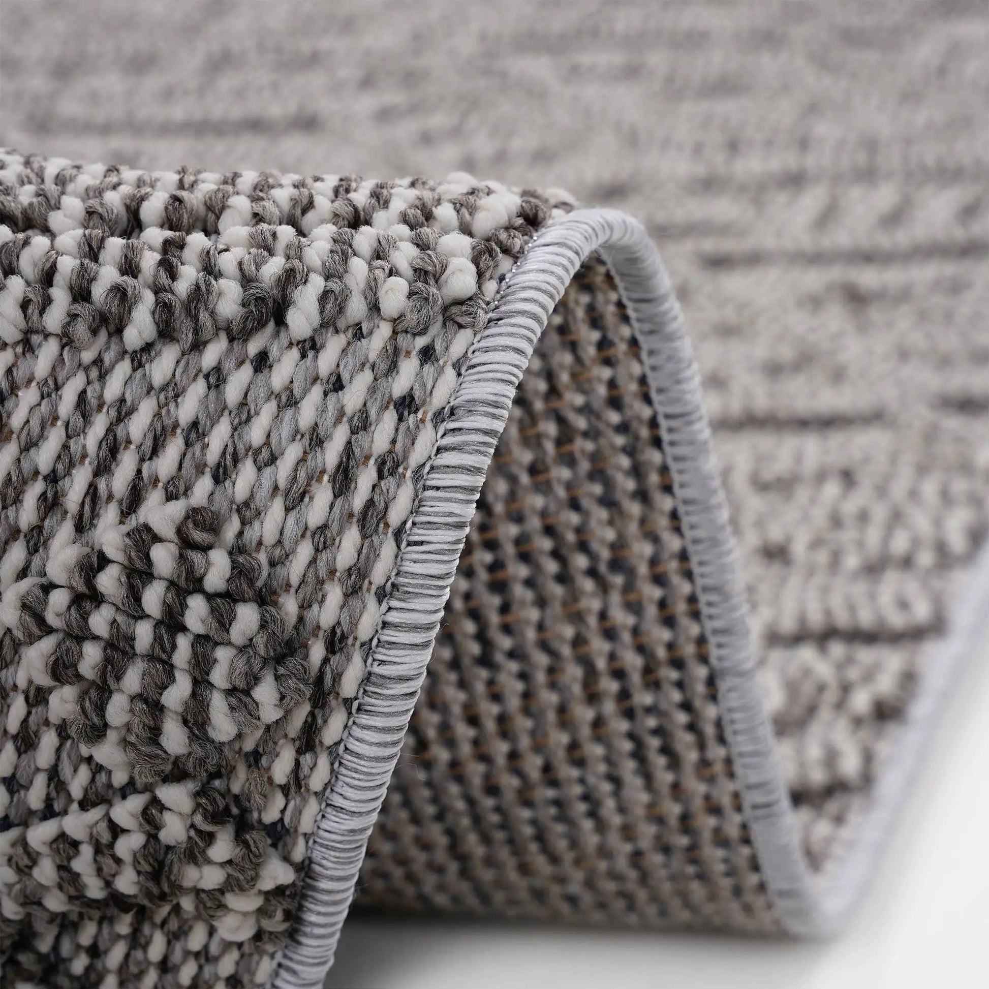 Guros indoor/outdoor rug in grey looped yarn with braided edge by Unique Piece Furniture on Tampa Home & Garden Store