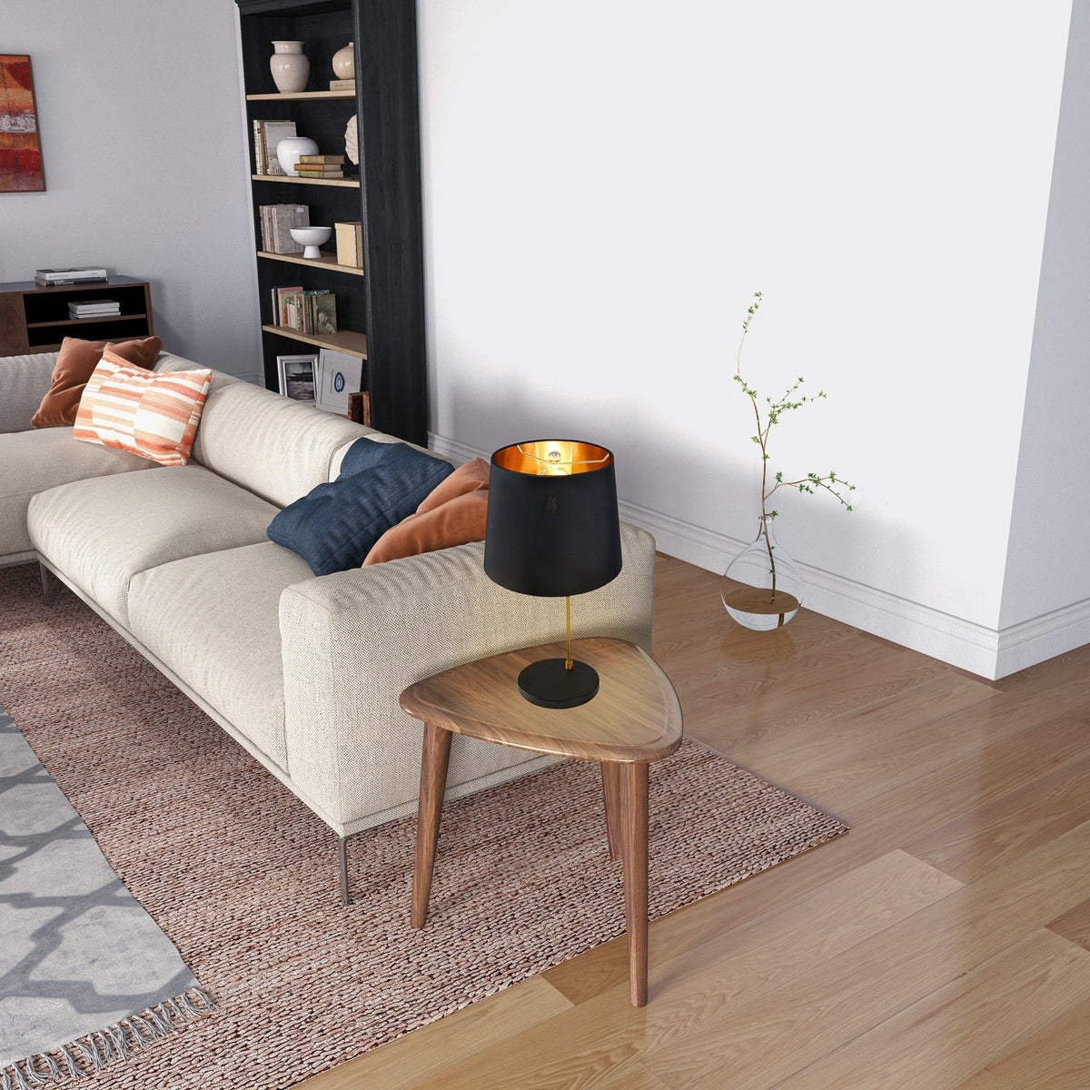 Desk lamp black with gold interior on a round wooden side table beside a beige sofa on Tampa Home & Garden Store