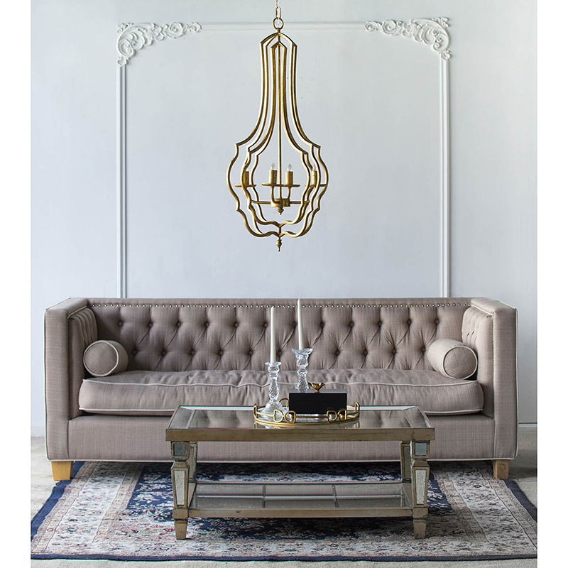 4-light gold chandelier with open-frame design and adjustable chain over a tufted sofa on Tampa Home & Garden Store