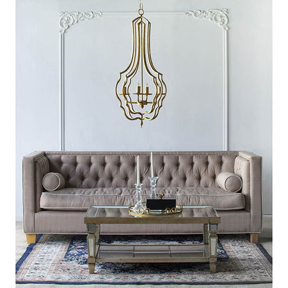 4-light gold chandelier with open-frame design and adjustable chain over a tufted sofa on Tampa Home & Garden Store