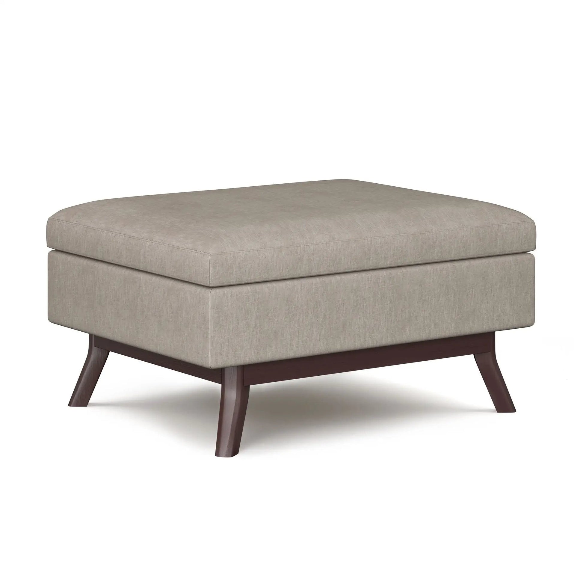 Owen upholstered rectangular storage ottoman in beige fabric with dark wood legs on Tampa Home & Garden Store