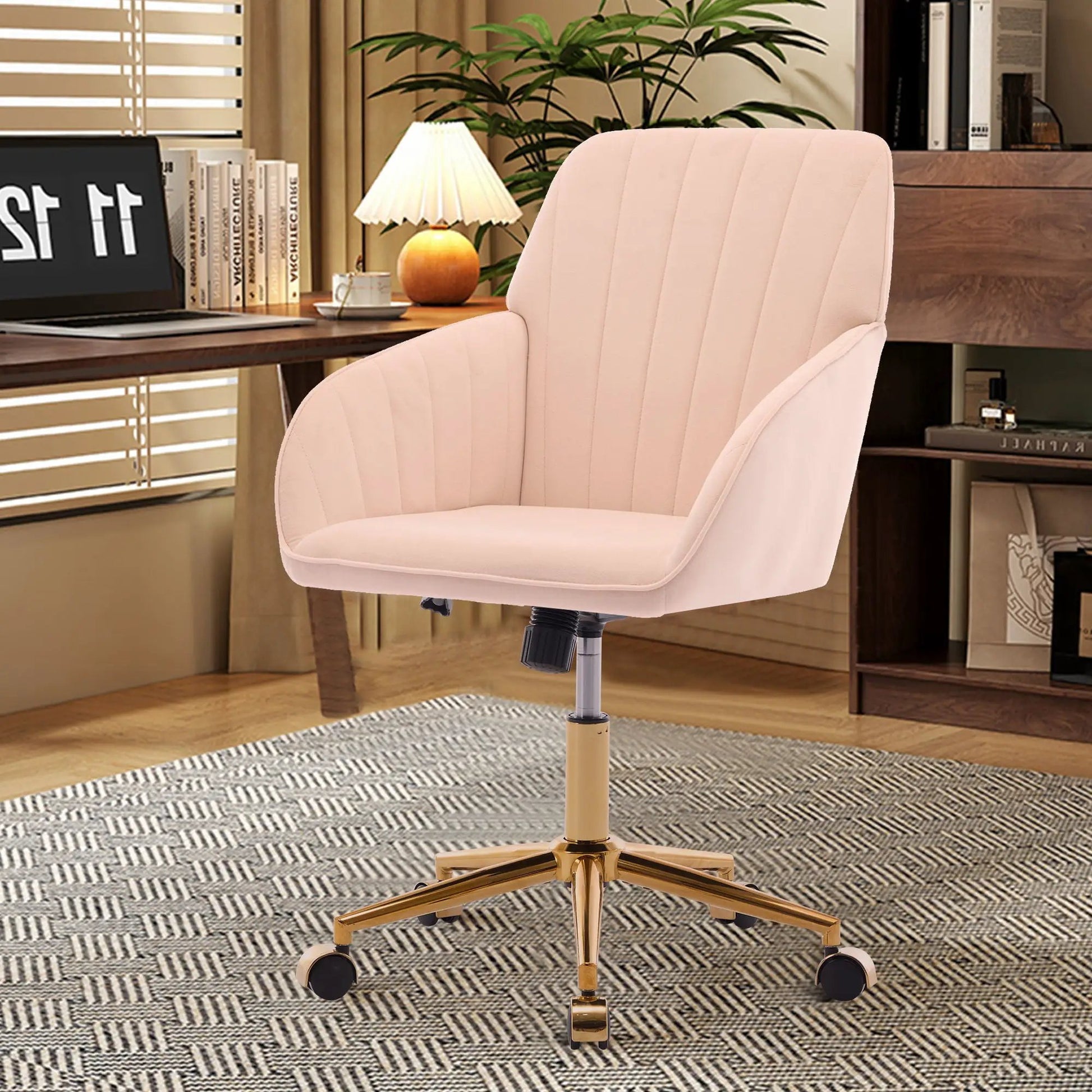 Adjustable ergonomic swivel office chair in blush pink upholstery with a gold base on Tampa Home & Garden Store