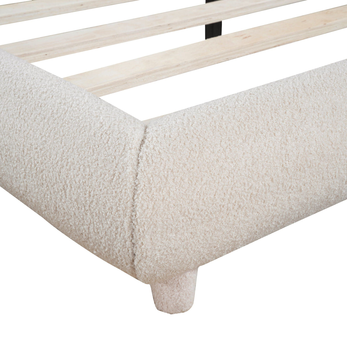 Platform bed slat frame with light wood planks and black center support over beige carpet on Tampa Home & Garden Store