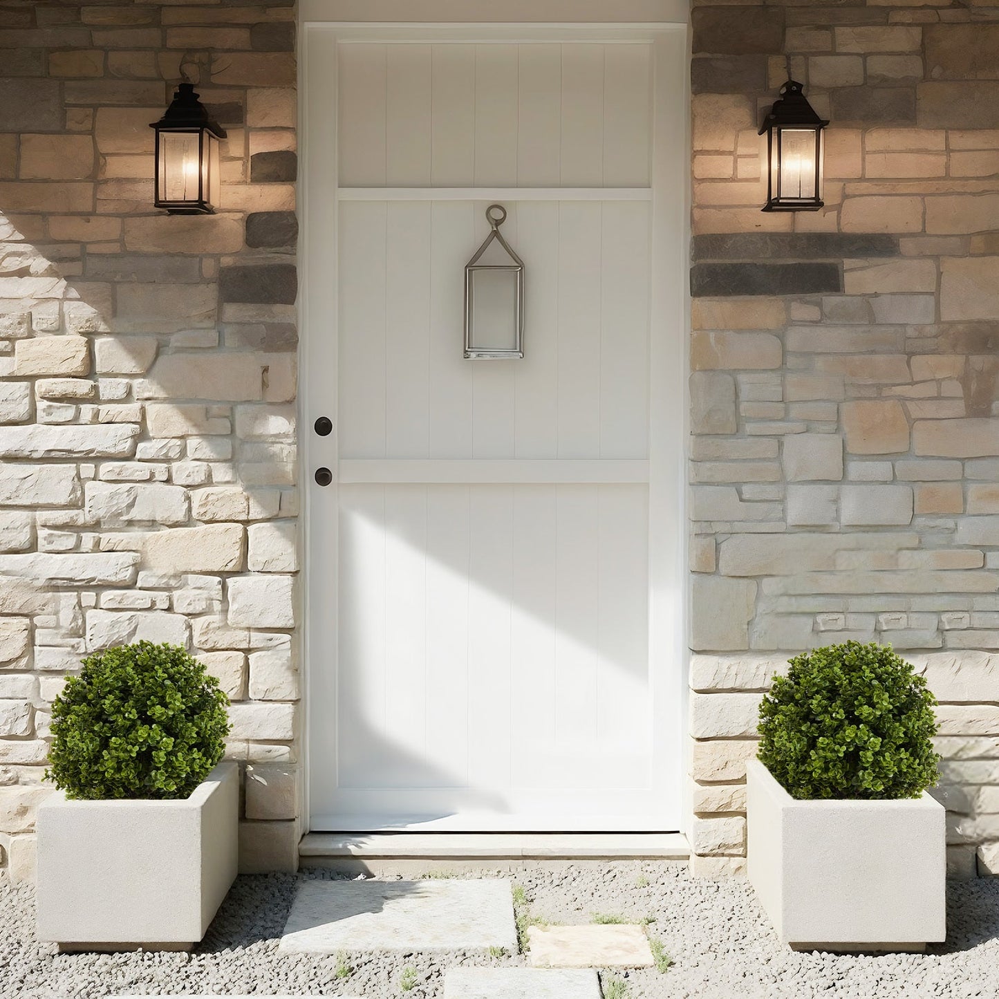 Pair of 22in artificial boxwood ball topiary shrubs in white pots flanking front door on Tampa Home & Garden Store