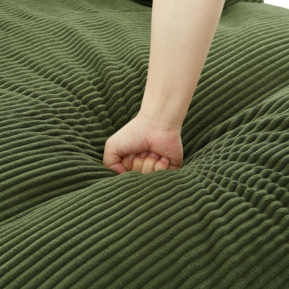 Bare foot resting on olive-green ribbed carpet rug with textured stripes on Tampa Home & Garden Store