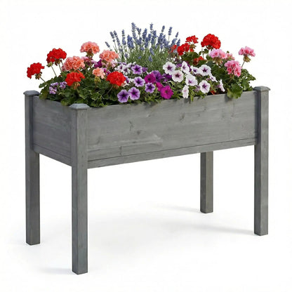 Elevated gray wooden planter bed on legs for outdoor use with blooms Unique Piece Furniture on Tampa Home & Garden Store