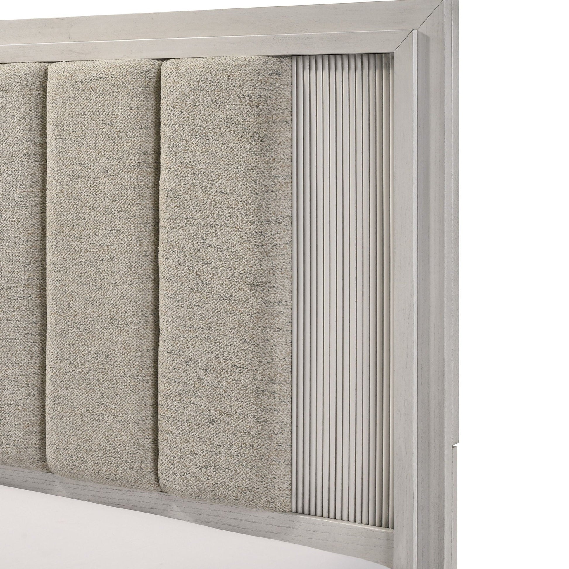 Plush upholstered headboard with fabric panels in a light gray wood frame and vertical ribbing on Tampa Home & Garden Store