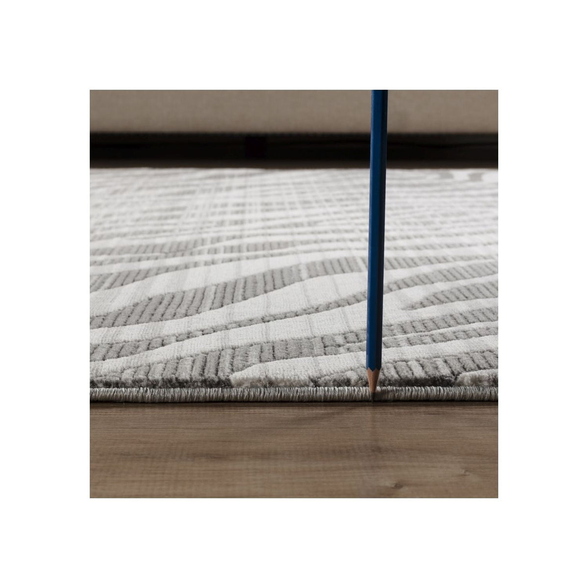 Plush geometric area rug ivory gray hues by HouseOfZazla, soft pile; blue pencil for scale on Tampa Home & Garden Store