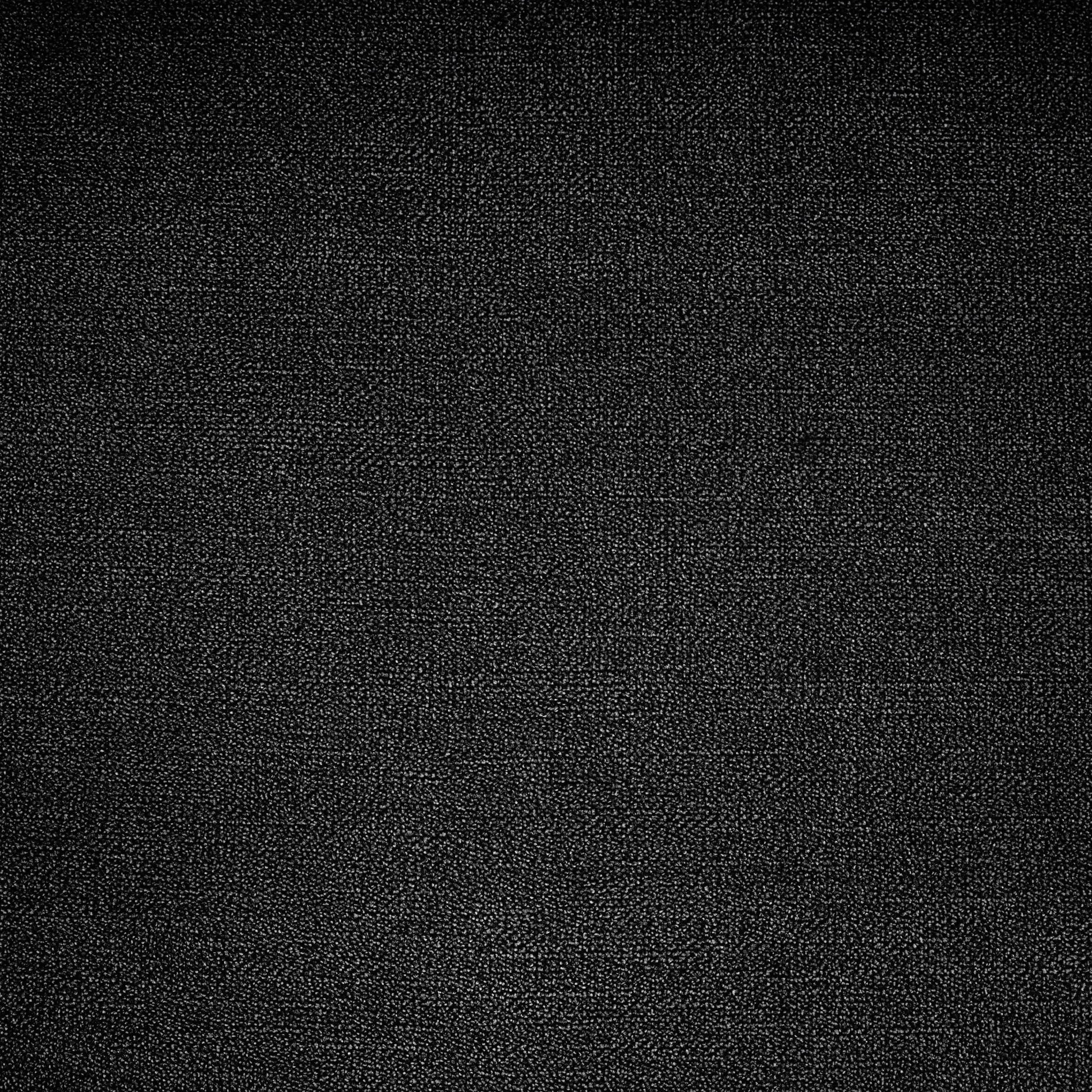 Black speckled carpet close-up, flooring backdrop for Unique Piece Furniture sectionals on Tampa Home & Garden Store