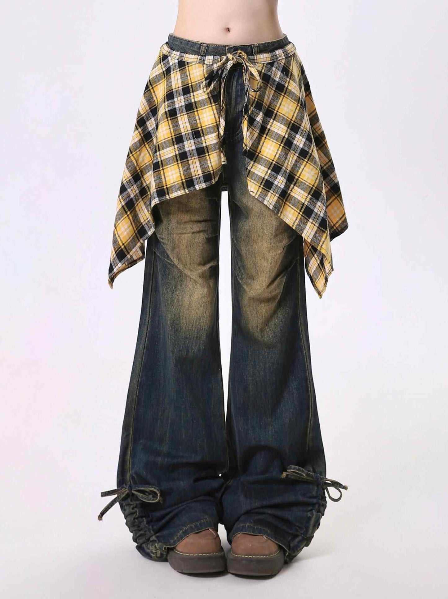 Plaid wrap skirt over dark bootcut jeans with waist tie casual layered look on Tampa Home & Garden Store