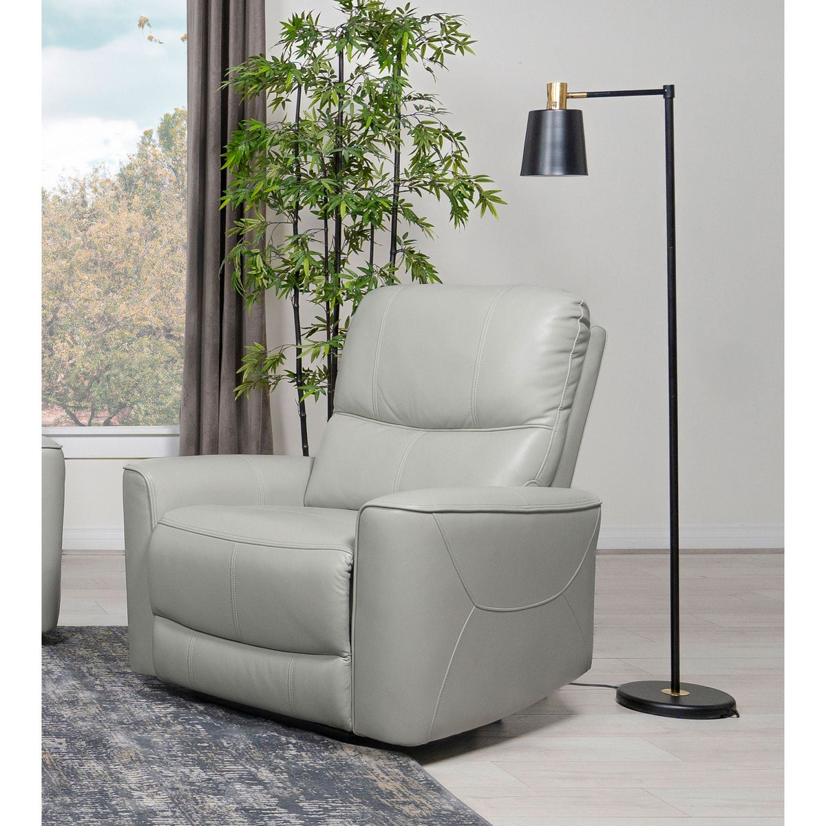 Power recliner chair with gray faux-leather and USB charging in a modern living room on Tampa Home & Garden Store