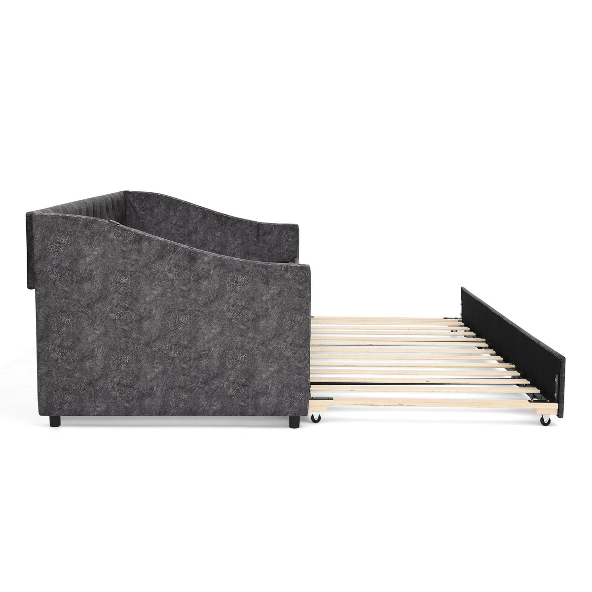 Upholstered daybed with curved back in dark gray fabric and a pull-out bed on slats on Tampa Home & Garden Store