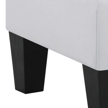Upholstered ottoman with light gray fabric and dark wood legs on Tampa Home & Garden Store