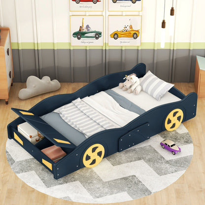 Race car shaped platform bed in navy blue with yellow wheels and built-in storage drawers on Tampa Home & Garden Store