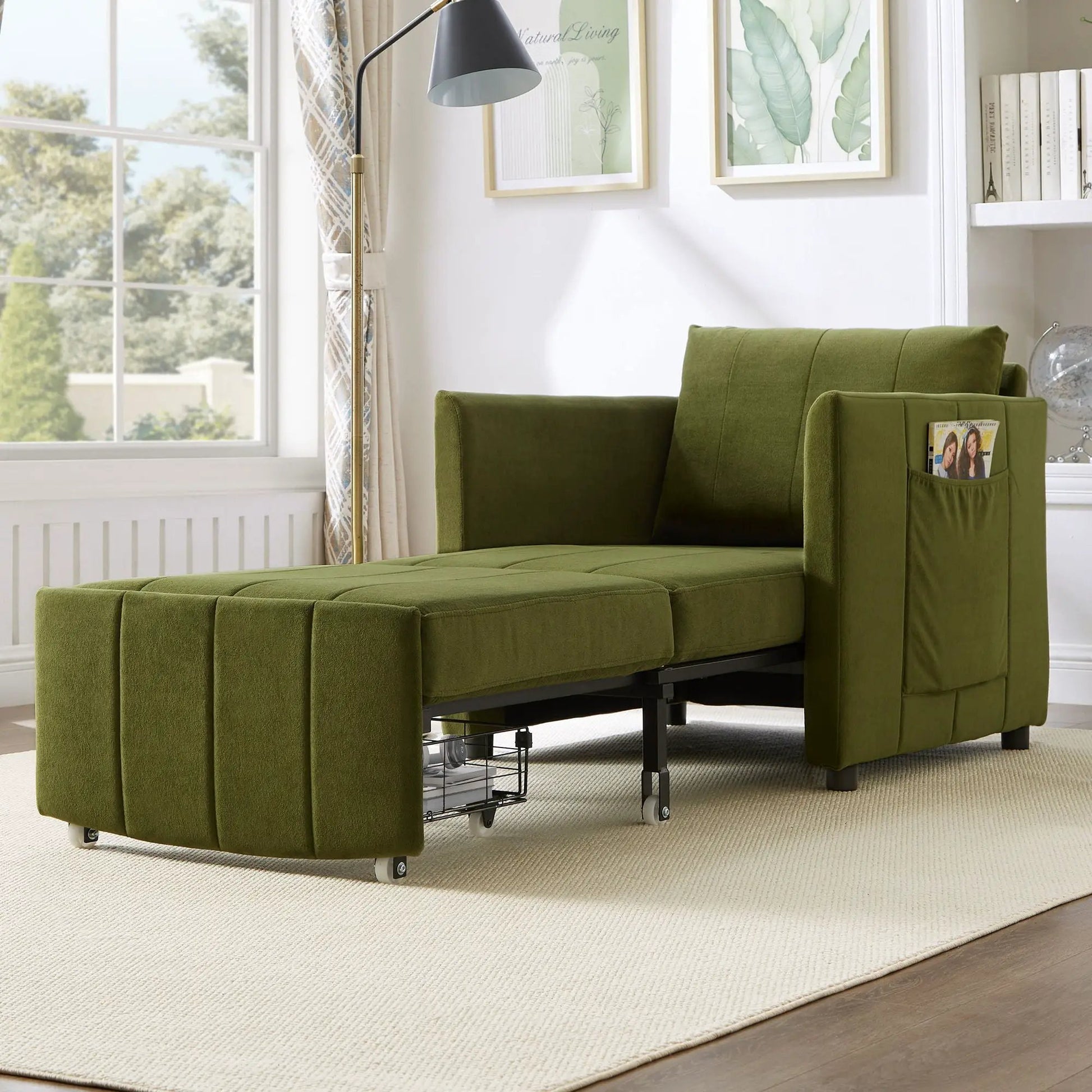 Upholstered green sleeper futon sofa with side pockets and storage, rolling metal base in room on Tampa Home & Garden Store