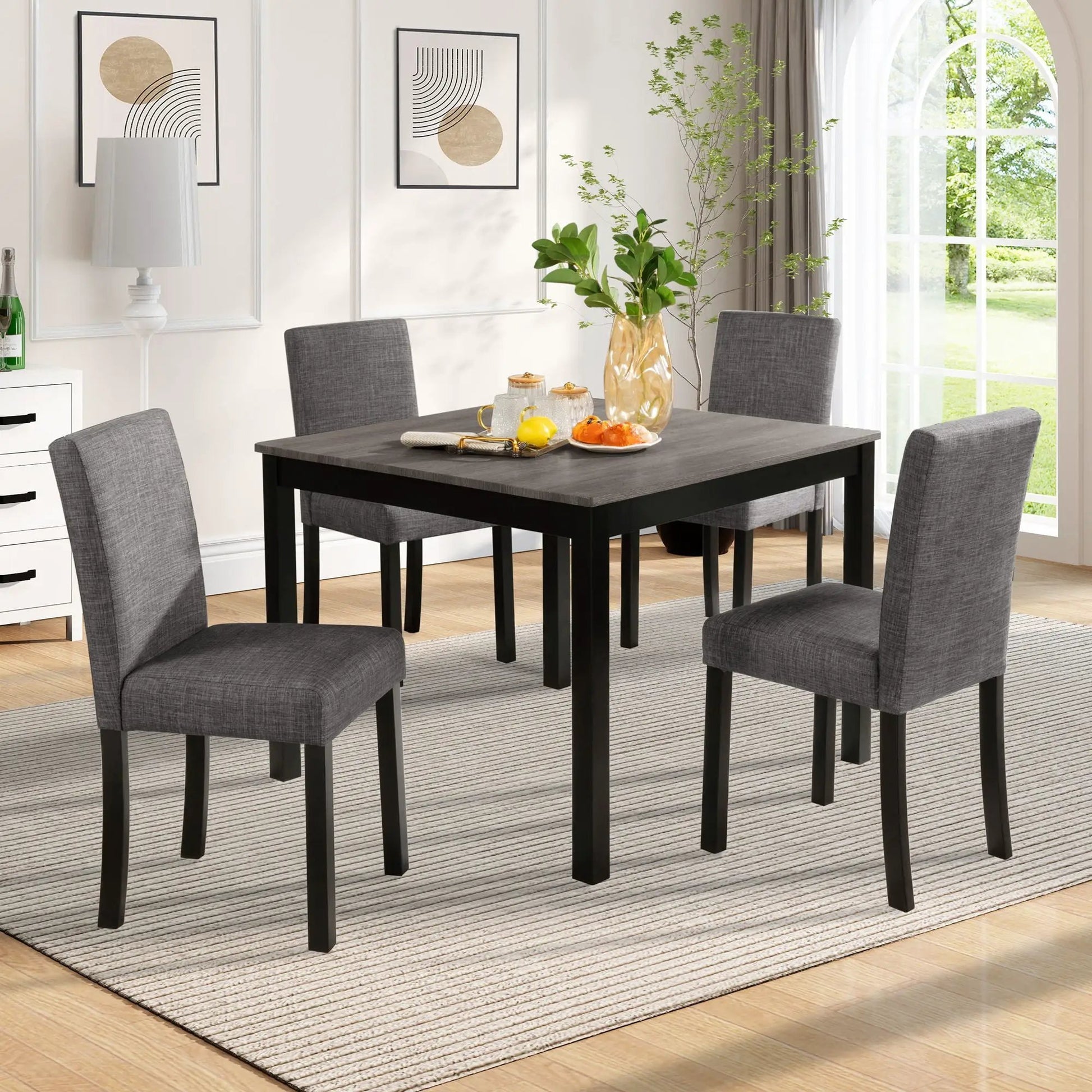 Modern dining table set with four upholstered gray chairs by Unique Piece Furniture on Tampa Home & Garden Store