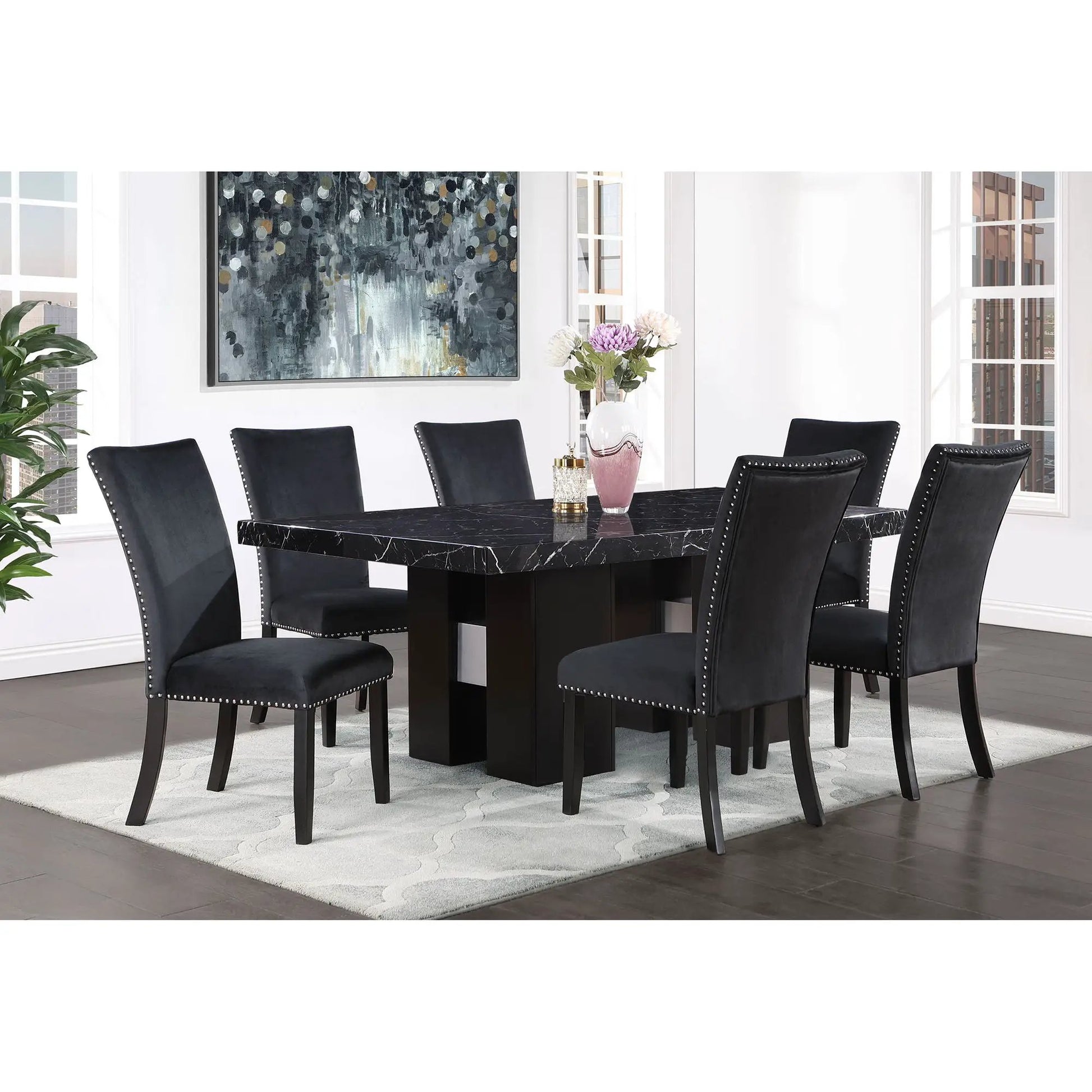 Jhoanna dining chairs, black upholstered with nailhead trim, 8 around a black marble table on Tampa Home & Garden Store