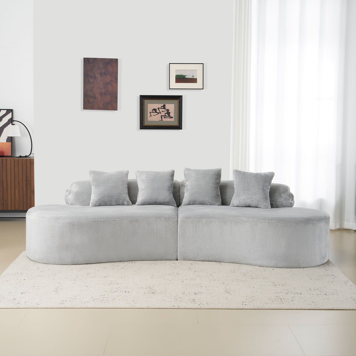Modern Curved Sofa and the Soft Linen Pillows