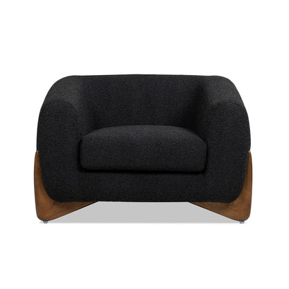 Alpine Sherpa Arm Chair in black textured fabric with a warm curved wooden base on Tampa Home & Garden Store