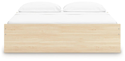 Onita Platform Bed, light oak storage bed by Unique Piece Furniture with white bedding on Tampa Home & Garden Store