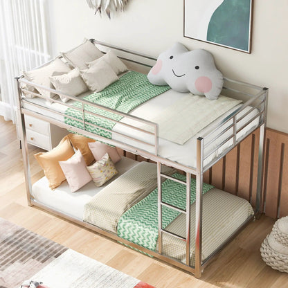 Low metal bunk bed with ladder, silver frame, multiple beige pillows, Unique Piece Furniture on Tampa Home & Garden Store