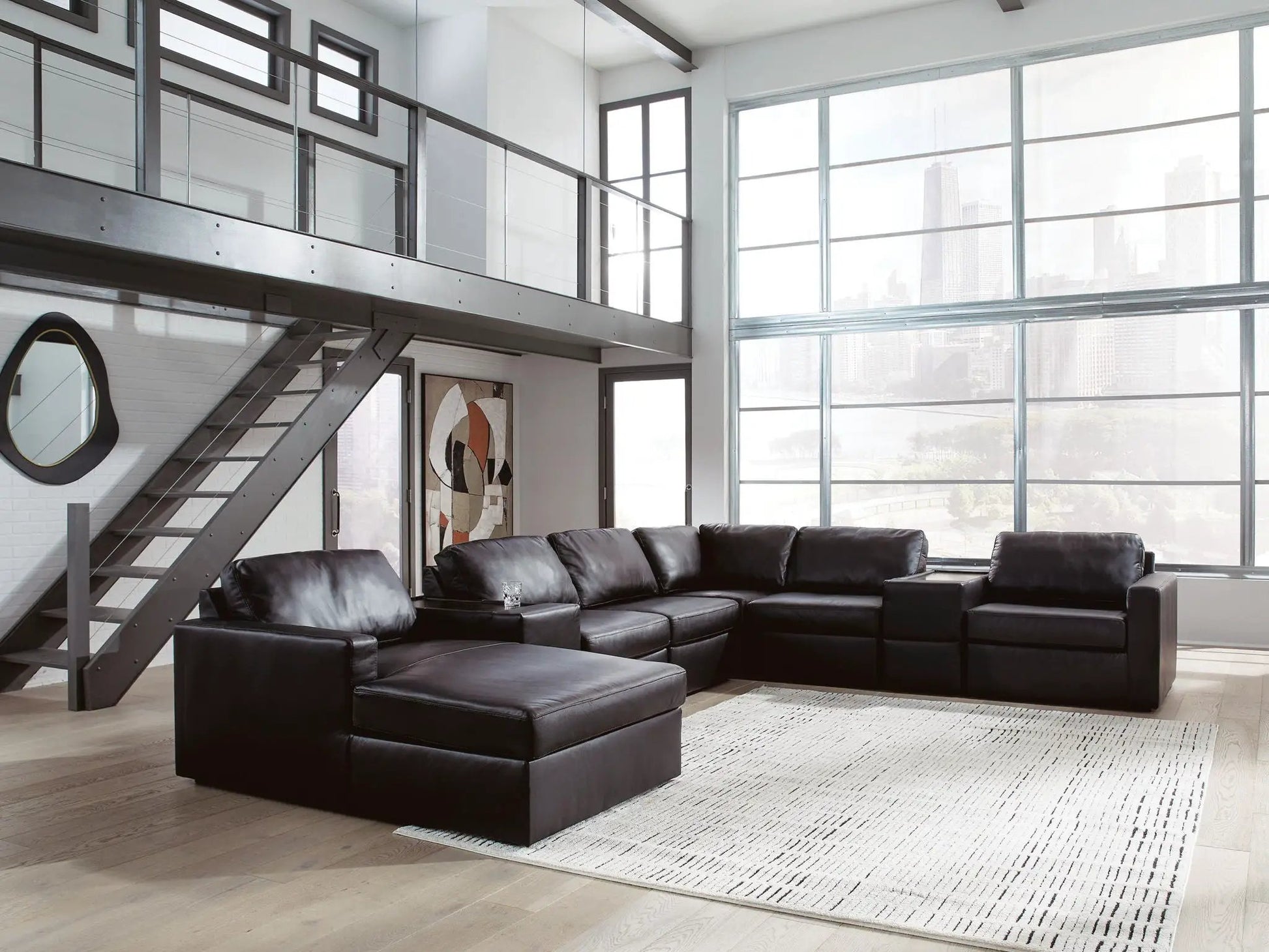 ModMax II Sectional in black leather with metal frame in a modern loft living room on Tampa Home & Garden Store