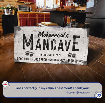 Good Times Man Cave Sign III canvas with rustic gray textured background and bold black MANCAVE lettering on Tampa Home & Garden Store