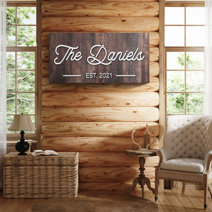 Family Name Sign IV canvas on dark wood plank wall with The Daniels EST 2021 text on Tampa Home & Garden Store