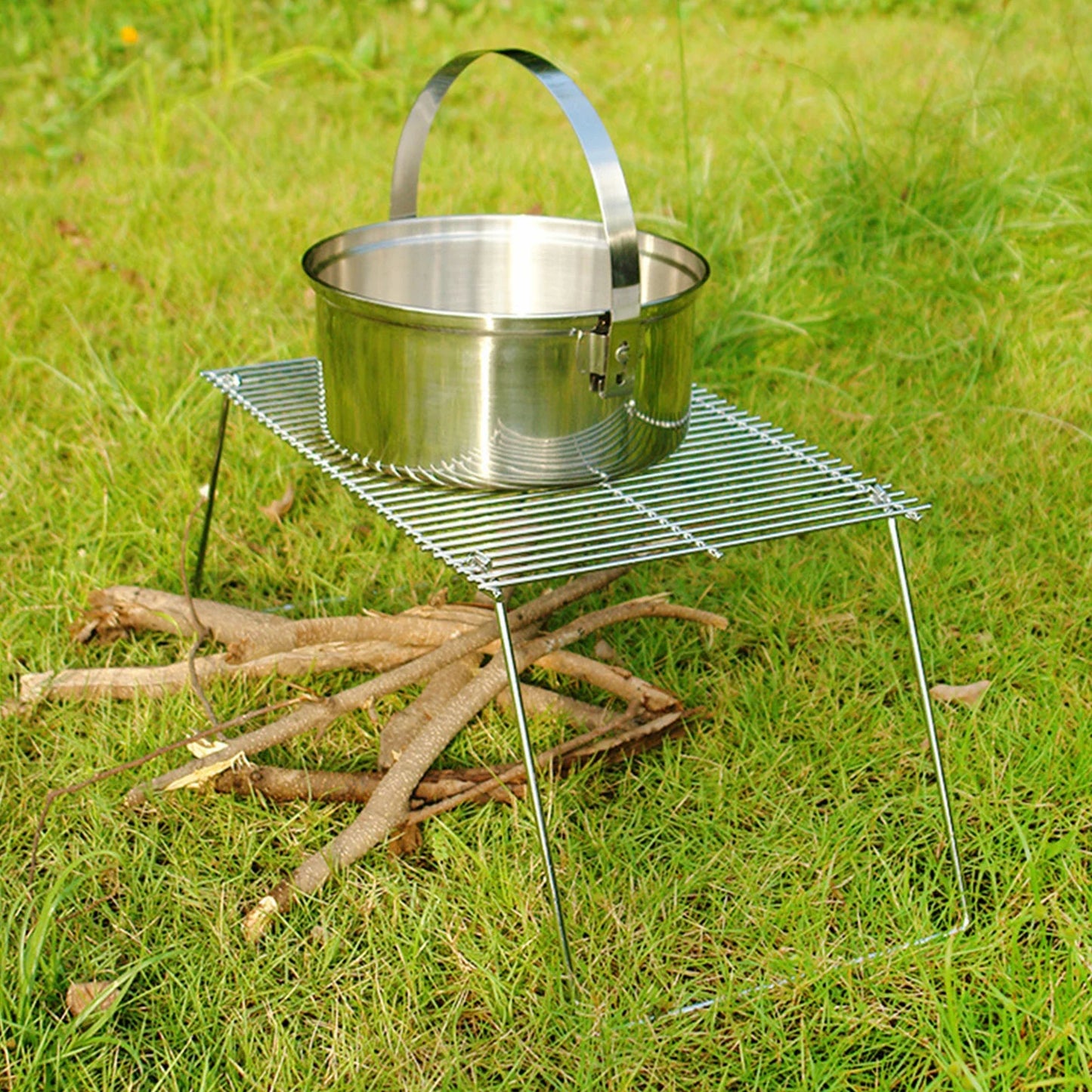 Folding campfire grill with stainless steel pot on portable wire rack outdoors on Tampa Home & Garden Store