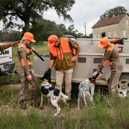 Training Collar Setup Hoss Straps hunting dog collars with three handlers and two dogs by trailer on Tampa Home & Garden Store