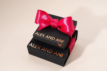 Gift Box set by Alex and Ani; stacked black gift boxes with a bright pink satin ribbon bow on Tampa Home & Garden Store