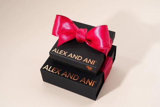 Gift Box set by Alex and Ani; stacked black gift boxes with a bright pink satin ribbon bow on Tampa Home & Garden Store