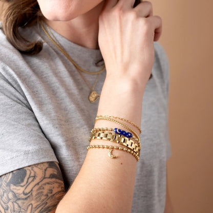 Starry Night Barrel Closure Bracelet by ALEX AND ANI on gold-tone bracelets with blue star accents on Tampa Home & Garden Store