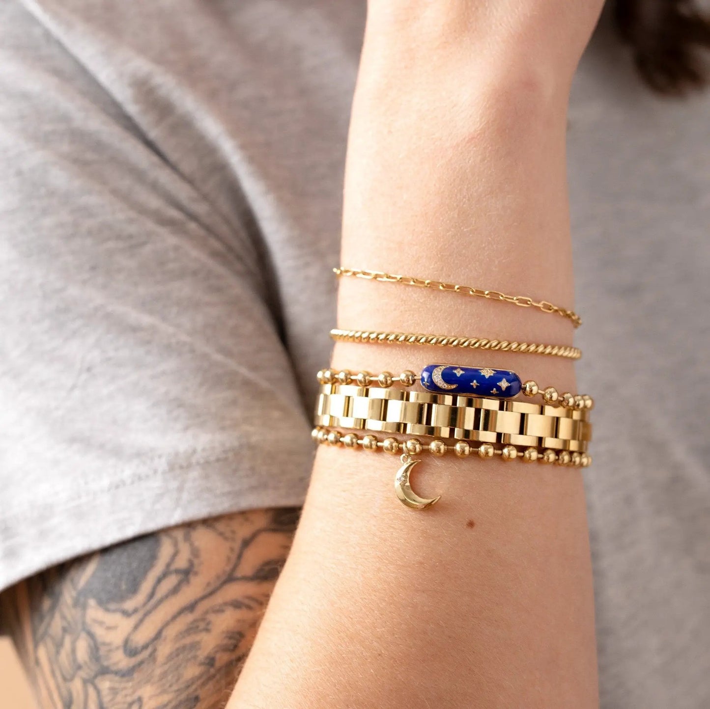 Starry Night Barrel Closure Bracelet by ALEX AND ANI; gold-tone chain with blue starry bead on Tampa Home & Garden Store