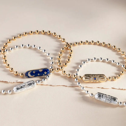 Bracelet collection of gold-tone and silver-tone beaded chains with enamel accents on Tampa Home & Garden Store