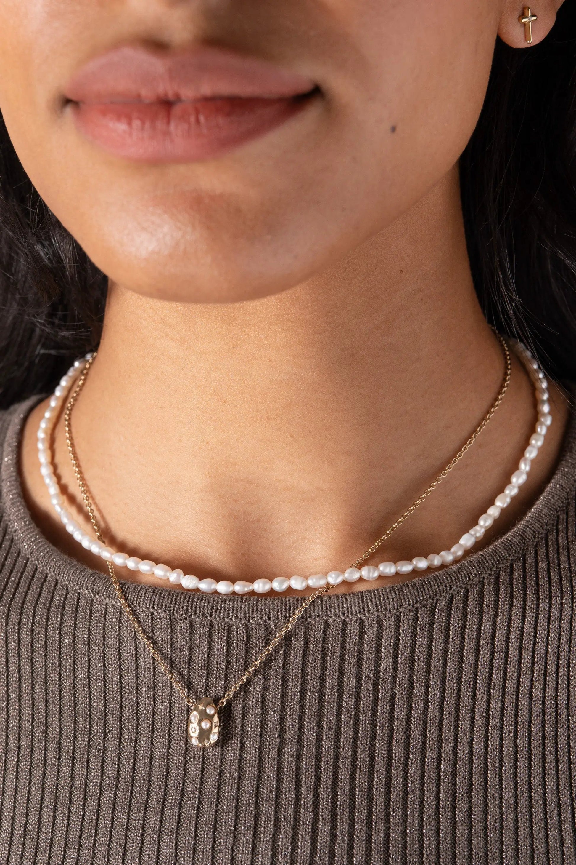 Freshwater Pearl Necklace by ALEX AND ANI with layered gold pendant necklace on model on Tampa Home & Garden Store