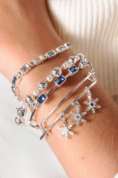 September Emerald Cut Bangle with blue stones in silver, stacked pearls and snowflake charms on Tampa Home & Garden Store