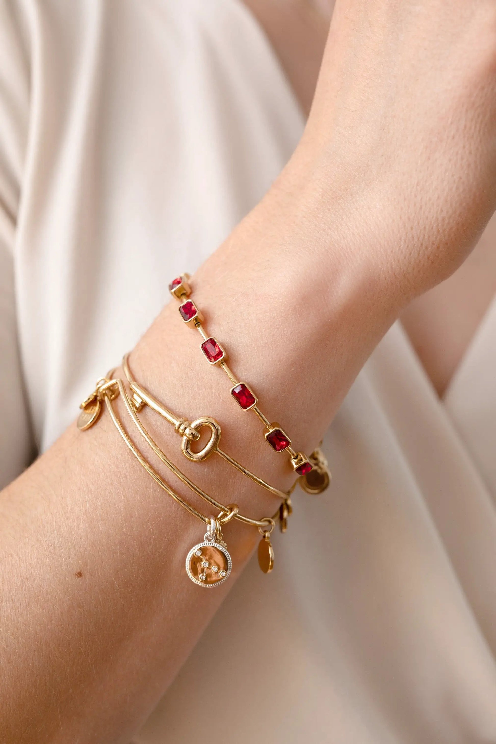 Bracelet July Birthstone Emerald Cut Bangle by ALEX AND ANI in gold with ruby-red stones on Tampa Home & Garden Store