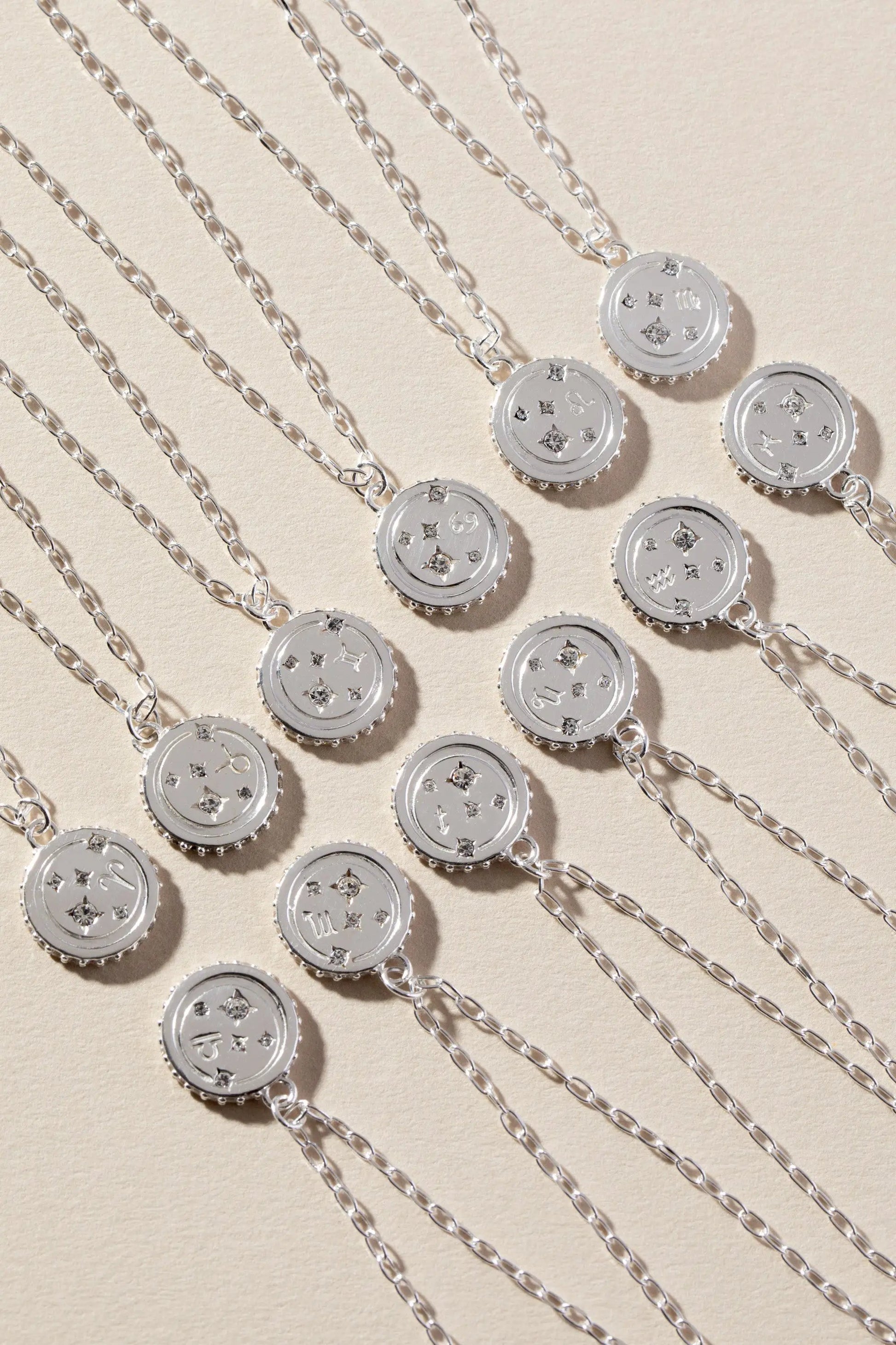 Taurus Zodiac Necklace by ALEX AND ANI, silver tone coin pendants with crystals, layered chains on Tampa Home & Garden Store