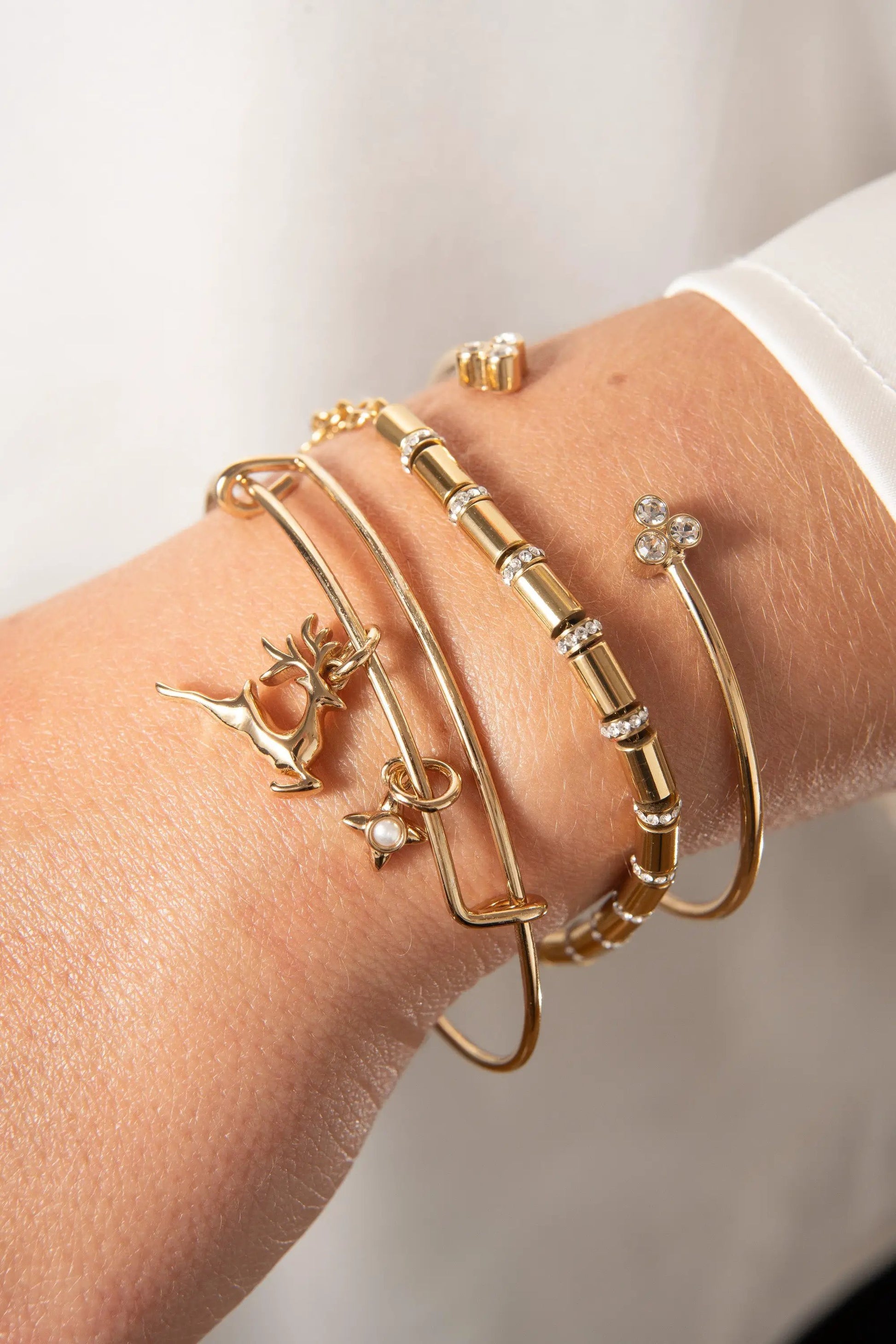 Holiday Reindeer Bangle by ALEX AND ANI: gold-tone bracelets with deer charm and crystals on Tampa Home & Garden Store