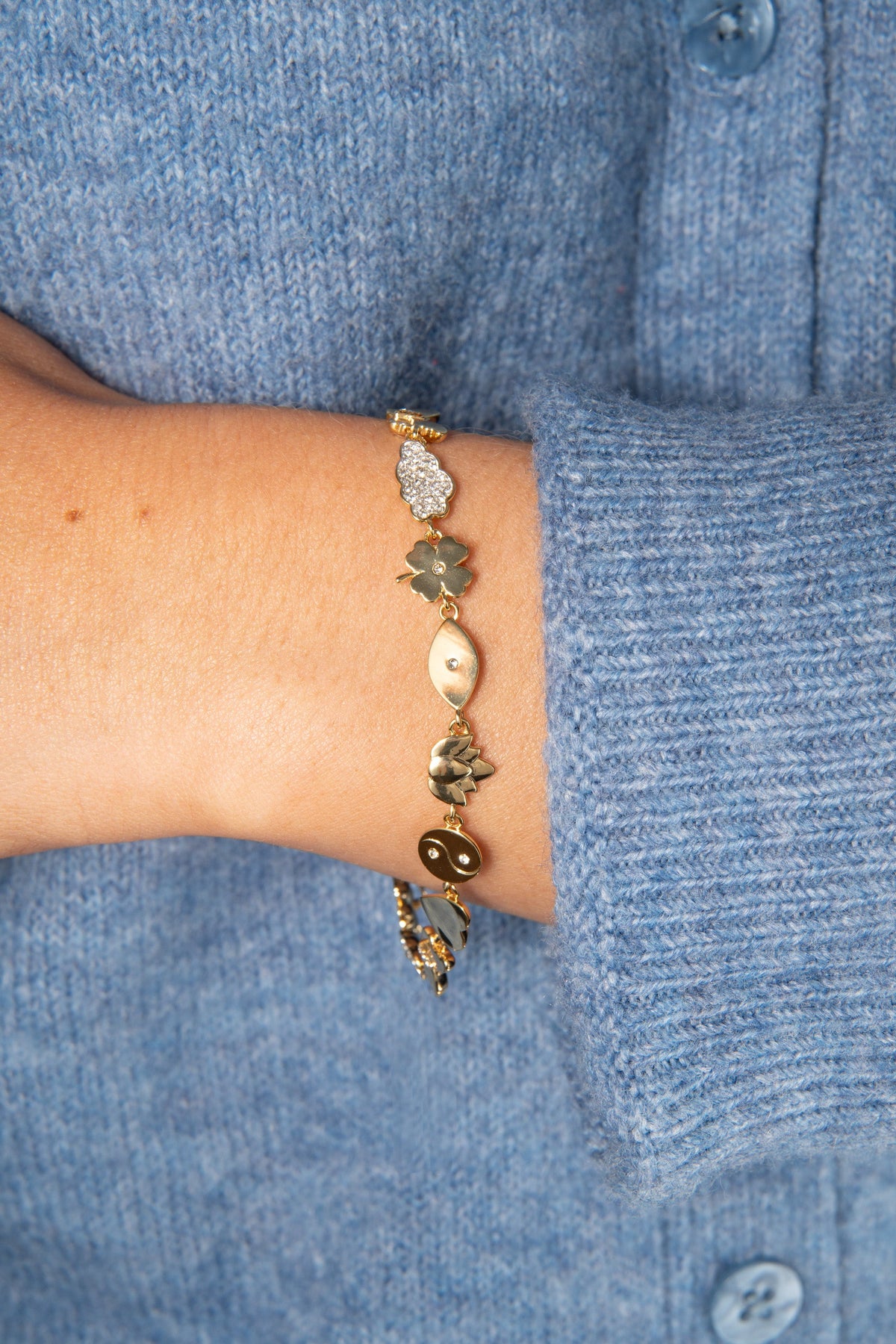 Silver Linings Chain Bracelet with cloud crystal and four-leaf clover charms on wrist on Tampa Home & Garden Store