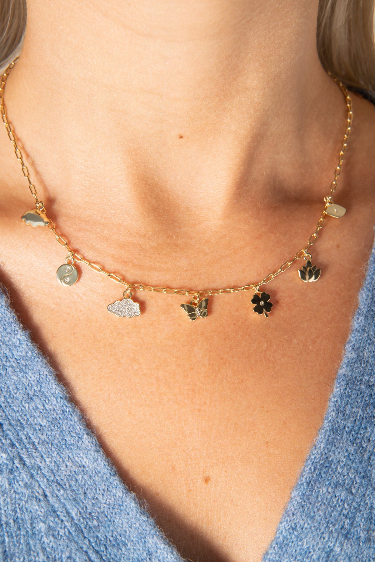 Silver Linings Charm Necklace gold-tone chain with cloud butterfly and flower charms on Tampa Home & Garden Store